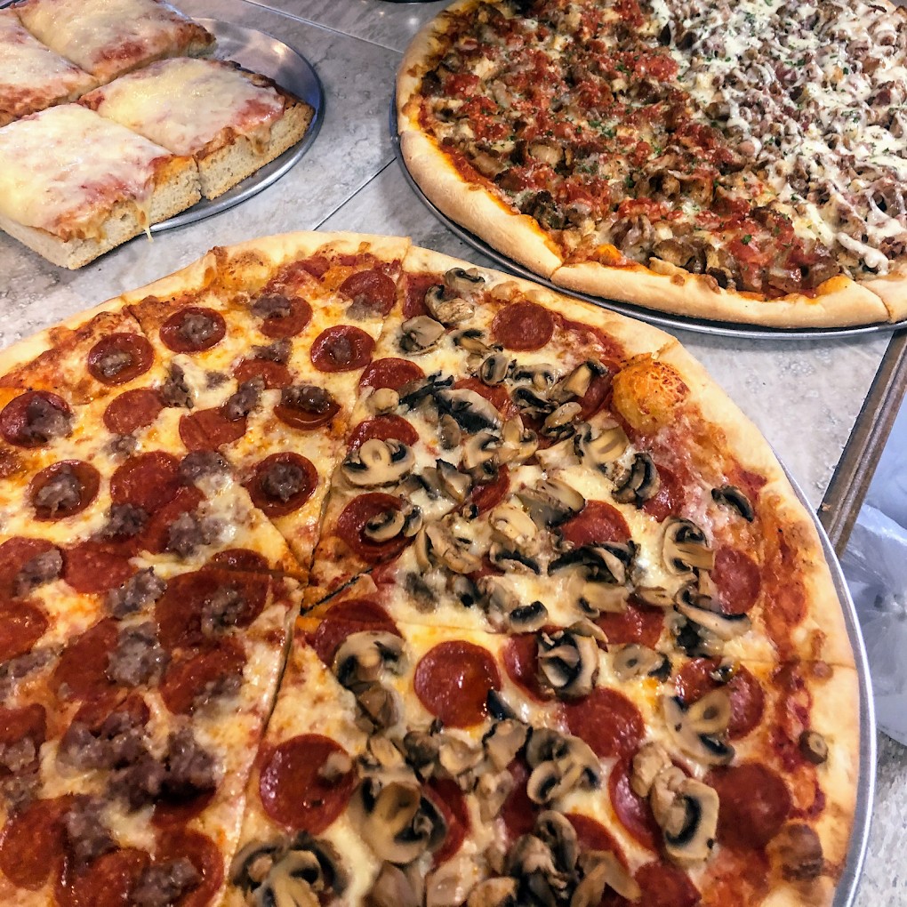 Variety of specialty pizzas at Pecorino's Pizzeria